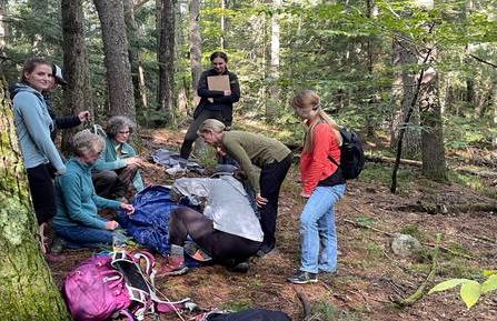 Group of women in the woods using hypowrap on an actor